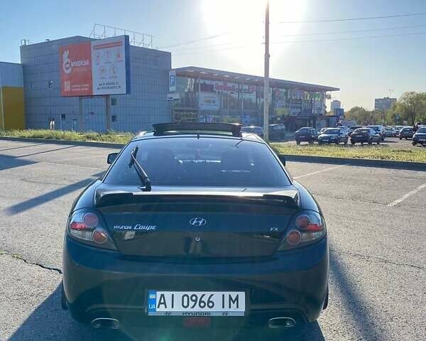 Чорний Хендай Купе, об'ємом двигуна 2 л та пробігом 186 тис. км за 6500 $, фото 4 на Automoto.ua