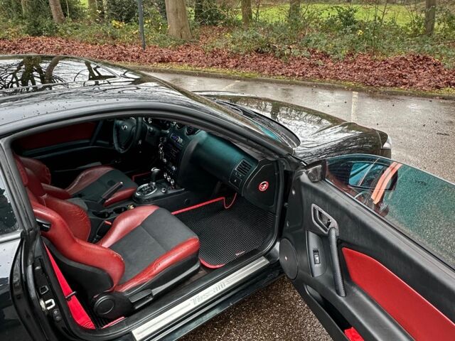 Чорний Хендай Купе, об'ємом двигуна 2 л та пробігом 198 тис. км за 8152 $, фото 6 на Automoto.ua