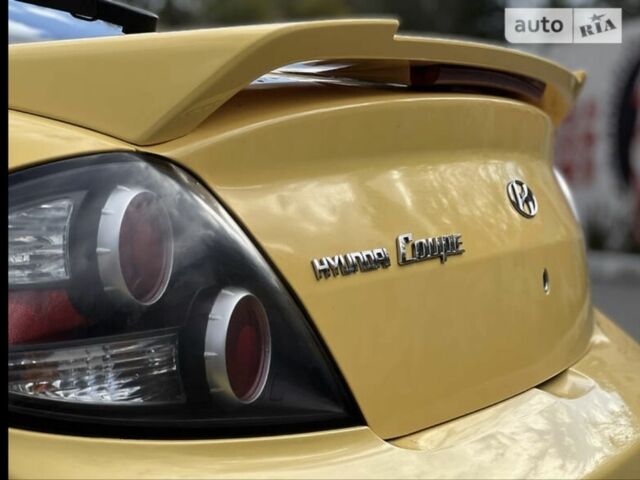 Жовтий Хендай Купе, об'ємом двигуна 2 л та пробігом 198 тис. км за 7199 $, фото 12 на Automoto.ua