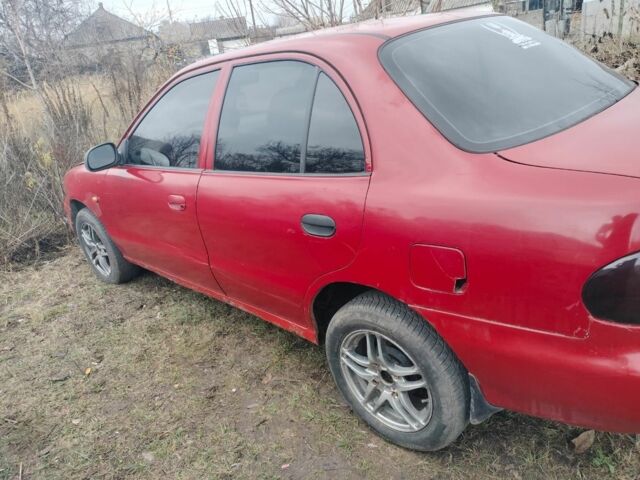 Красный Хендай Другая, объемом двигателя 1.3 л и пробегом 470 тыс. км за 600 $, фото 2 на Automoto.ua