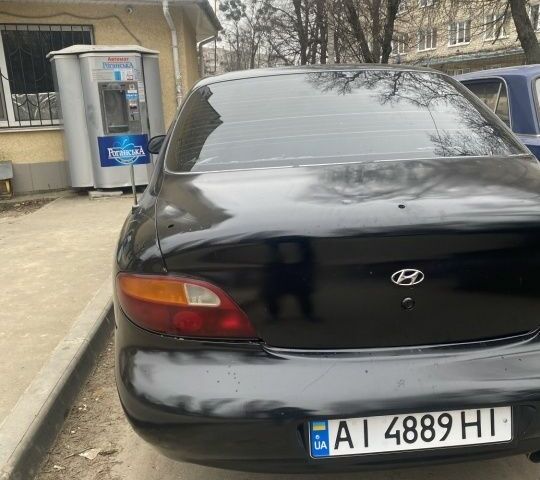 Черный Хендай Элантра, объемом двигателя 1.8 л и пробегом 400 тыс. км за 1500 $, фото 1 на Automoto.ua