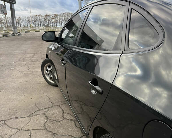 Черный Хендай Элантра, объемом двигателя 1.59 л и пробегом 264 тыс. км за 5800 $, фото 3 на Automoto.ua