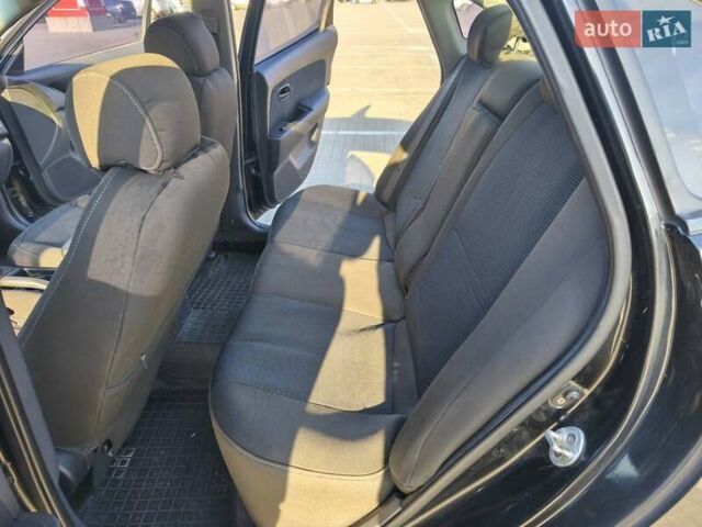 Черный Хендай Элантра, объемом двигателя 1.59 л и пробегом 213 тыс. км за 5300 $, фото 6 на Automoto.ua