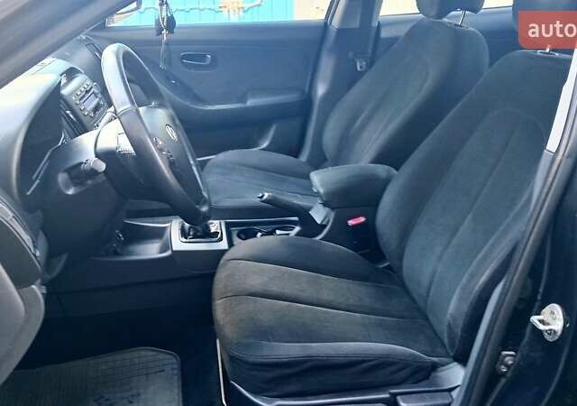 Черный Хендай Элантра, объемом двигателя 1.59 л и пробегом 184 тыс. км за 4975 $, фото 5 на Automoto.ua