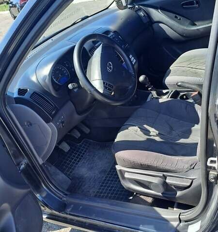 Черный Хендай Элантра, объемом двигателя 1.59 л и пробегом 255 тыс. км за 5000 $, фото 6 на Automoto.ua