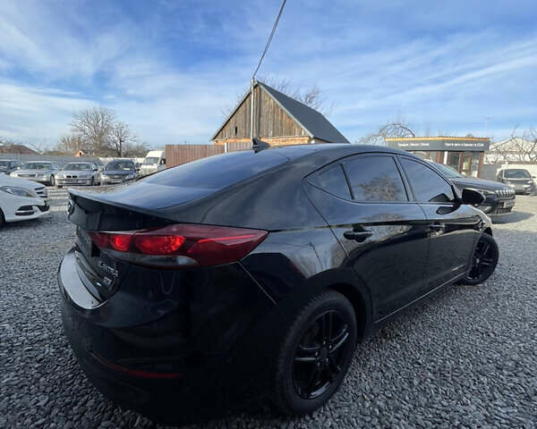 Чорний Хендай Елантра, об'ємом двигуна 2 л та пробігом 233 тис. км за 11800 $, фото 4 на Automoto.ua