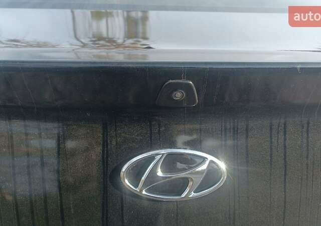 Черный Хендай Элантра, объемом двигателя 1.59 л и пробегом 98 тыс. км за 13800 $, фото 1 на Automoto.ua