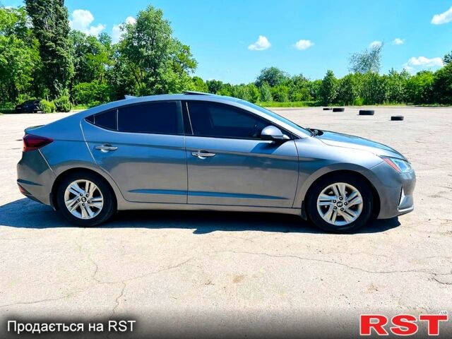 Сірий Хендай Елантра, об'ємом двигуна 2 л та пробігом 106 тис. км за 11999 $, фото 2 на Automoto.ua