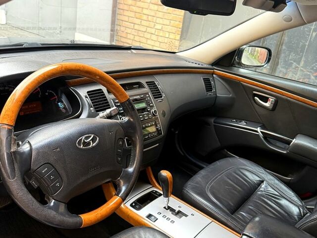 Черный Хендай Грандер, объемом двигателя 3.3 л и пробегом 299 тыс. км за 4999 $, фото 3 на Automoto.ua