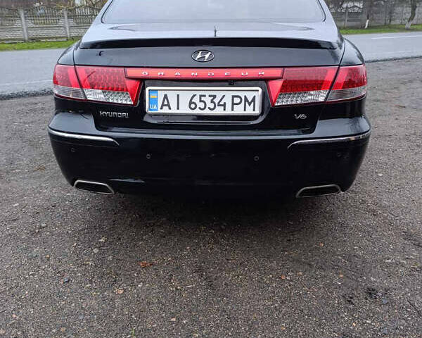 Черный Хендай Грандер, объемом двигателя 3.34 л и пробегом 240 тыс. км за 5500 $, фото 5 на Automoto.ua