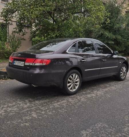 Красный Хендай Грандер, объемом двигателя 3.34 л и пробегом 243 тыс. км за 4000 $, фото 7 на Automoto.ua