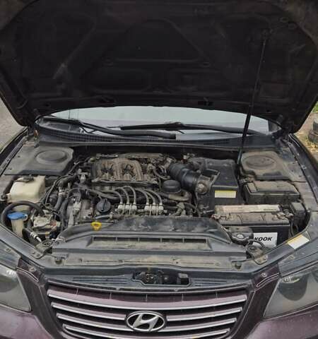 Красный Хендай Грандер, объемом двигателя 3.34 л и пробегом 243 тыс. км за 4000 $, фото 3 на Automoto.ua