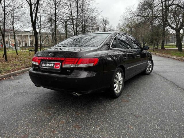 Красный Хендай Грандер, объемом двигателя 3.3 л и пробегом 246 тыс. км за 5990 $, фото 4 на Automoto.ua