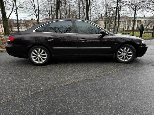 Красный Хендай Грандер, объемом двигателя 3.3 л и пробегом 246 тыс. км за 5990 $, фото 5 на Automoto.ua