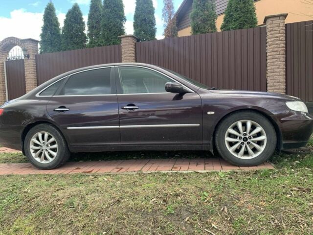 Красный Хендай Грандер, объемом двигателя 3.3 л и пробегом 400 тыс. км за 5000 $, фото 2 на Automoto.ua