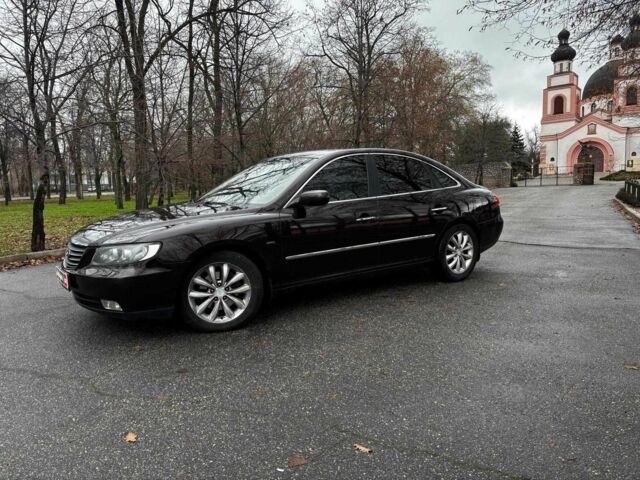 Красный Хендай Грандер, объемом двигателя 3.3 л и пробегом 246 тыс. км за 5990 $, фото 1 на Automoto.ua