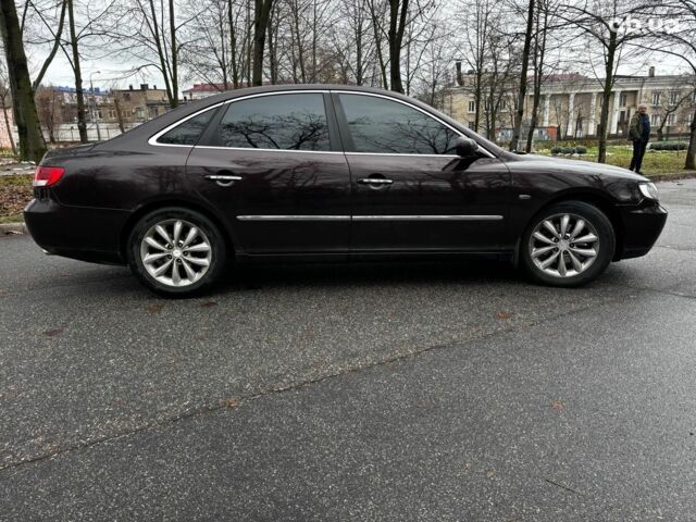 Червоний Хендай Грандер, об'ємом двигуна 3.3 л та пробігом 246 тис. км за 7490 $, фото 7 на Automoto.ua