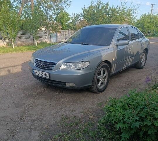 Серый Хендай Грандер, объемом двигателя 2.7 л и пробегом 280 тыс. км за 6700 $, фото 1 на Automoto.ua