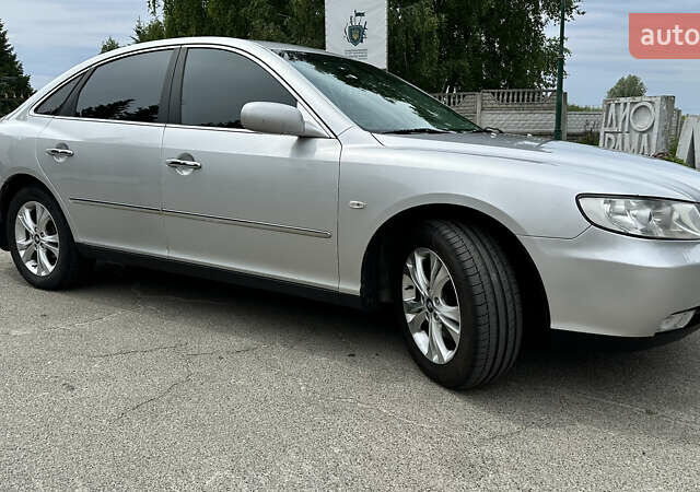 Серый Хендай Грандер, объемом двигателя 2.7 л и пробегом 247 тыс. км за 6700 $, фото 3 на Automoto.ua