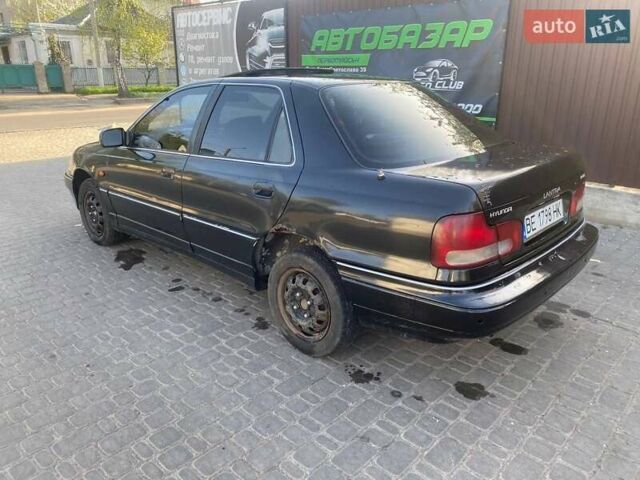 Чорний Хендай Лантра, об'ємом двигуна 1.47 л та пробігом 350 тис. км за 1800 $, фото 6 на Automoto.ua