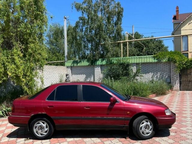 Красный Хендай Лантра, объемом двигателя 1.6 л и пробегом 260 тыс. км за 1000 $, фото 4 на Automoto.ua