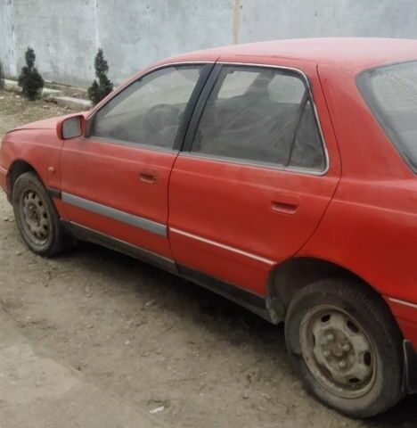 Червоний Хендай Лантра, об'ємом двигуна 1 л та пробігом 198 тис. км за 700 $, фото 9 на Automoto.ua