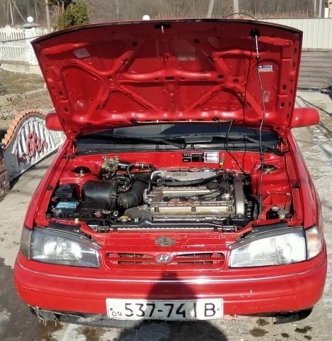 Червоний Хендай Лантра, об'ємом двигуна 1 л та пробігом 198 тис. км за 700 $, фото 10 на Automoto.ua