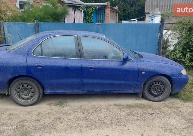 Синий Хендай Лантра, объемом двигателя 1.6 л и пробегом 300 тыс. км за 1850 $, фото 2 на Automoto.ua