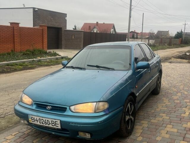 Зеленый Хендай Лантра, объемом двигателя 1.5 л и пробегом 200 тыс. км за 700 $, фото 2 на Automoto.ua