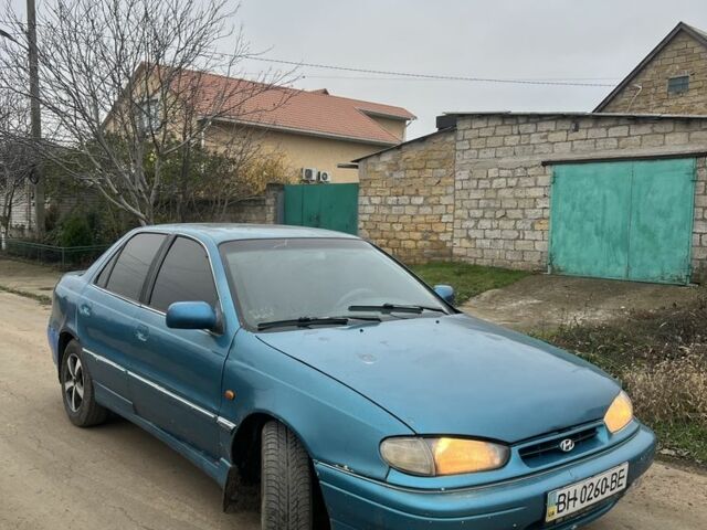 Зеленый Хендай Лантра, объемом двигателя 1.5 л и пробегом 200 тыс. км за 700 $, фото 1 на Automoto.ua