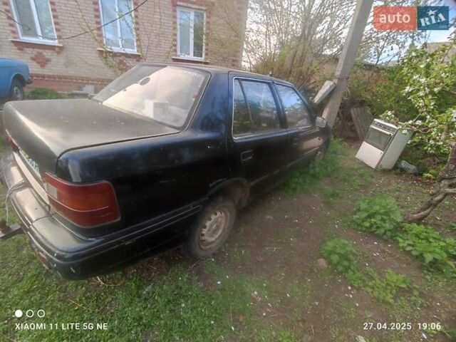 Черный Хендай Пони, объемом двигателя 1.5 л и пробегом 290 тыс. км за 270 $, фото 3 на Automoto.ua