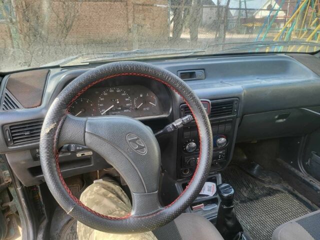 Зеленый Хендай Пони, объемом двигателя 1.5 л и пробегом 42 тыс. км за 1800 $, фото 7 на Automoto.ua