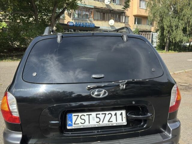 Черный Хендай Санта Фе, объемом двигателя 2 л и пробегом 257 тыс. км за 3700 $, фото 7 на Automoto.ua
