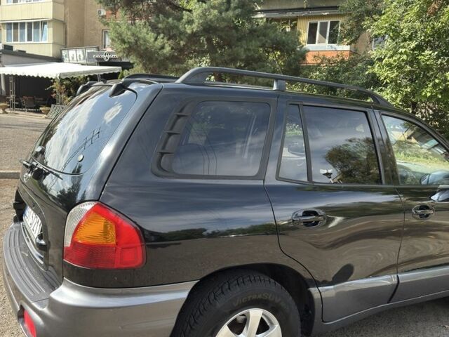 Черный Хендай Санта Фе, объемом двигателя 2 л и пробегом 257 тыс. км за 3700 $, фото 2 на Automoto.ua