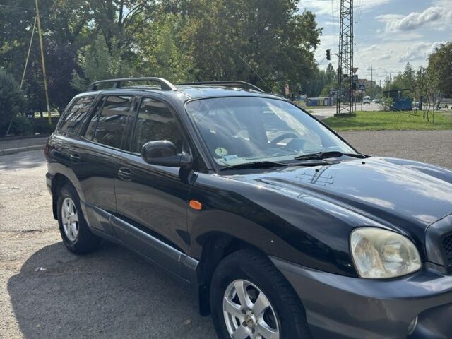 Черный Хендай Санта Фе, объемом двигателя 2 л и пробегом 257 тыс. км за 3700 $, фото 1 на Automoto.ua