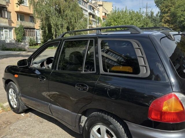 Черный Хендай Санта Фе, объемом двигателя 2 л и пробегом 257 тыс. км за 3700 $, фото 3 на Automoto.ua