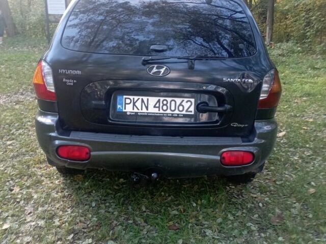 Черный Хендай Санта Фе, объемом двигателя 2 л и пробегом 300 тыс. км за 3200 $, фото 3 на Automoto.ua