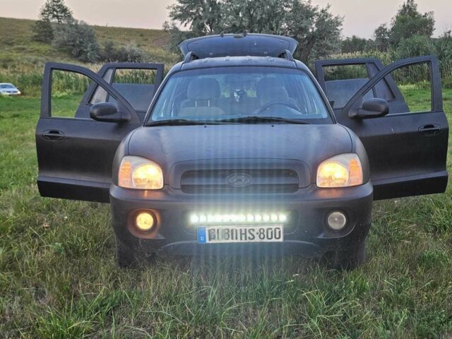 Черный Хендай Санта Фе, объемом двигателя 2 л и пробегом 305 тыс. км за 3098 $, фото 4 на Automoto.ua