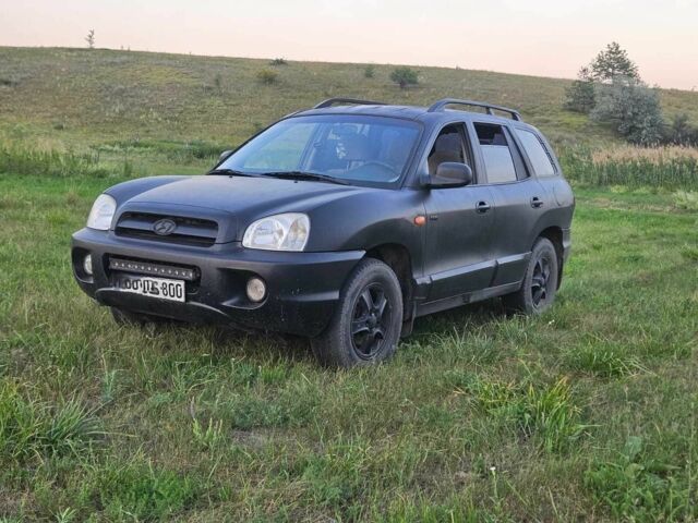 Черный Хендай Санта Фе, объемом двигателя 2 л и пробегом 305 тыс. км за 3098 $, фото 1 на Automoto.ua