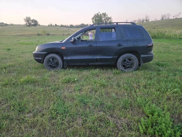 Черный Хендай Санта Фе, объемом двигателя 2 л и пробегом 305 тыс. км за 3098 $, фото 9 на Automoto.ua