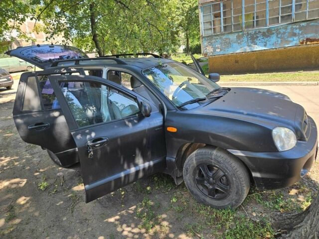 Черный Хендай Санта Фе, объемом двигателя 2 л и пробегом 305 тыс. км за 3098 $, фото 11 на Automoto.ua