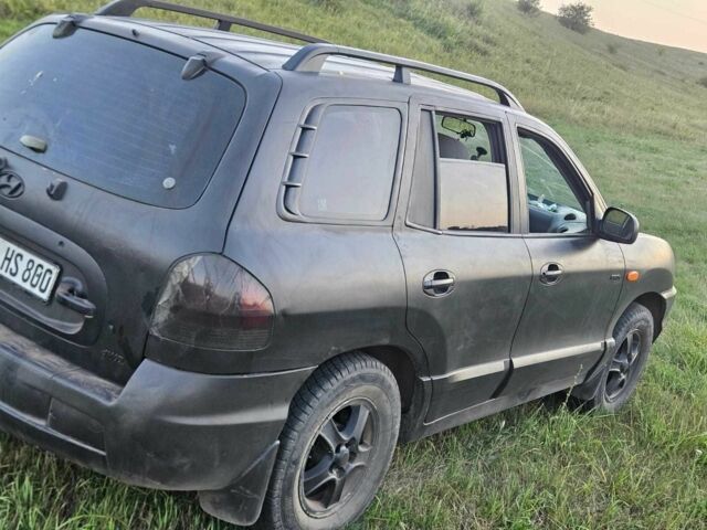Чорний Хендай Санта Фе, об'ємом двигуна 2 л та пробігом 305 тис. км за 3190 $, фото 2 на Automoto.ua