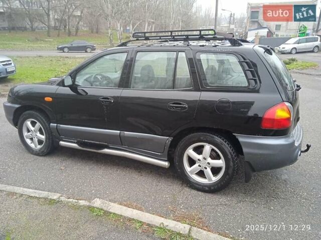 Черный Хендай Санта Фе, объемом двигателя 1.99 л и пробегом 359 тыс. км за 4500 $, фото 3 на Automoto.ua