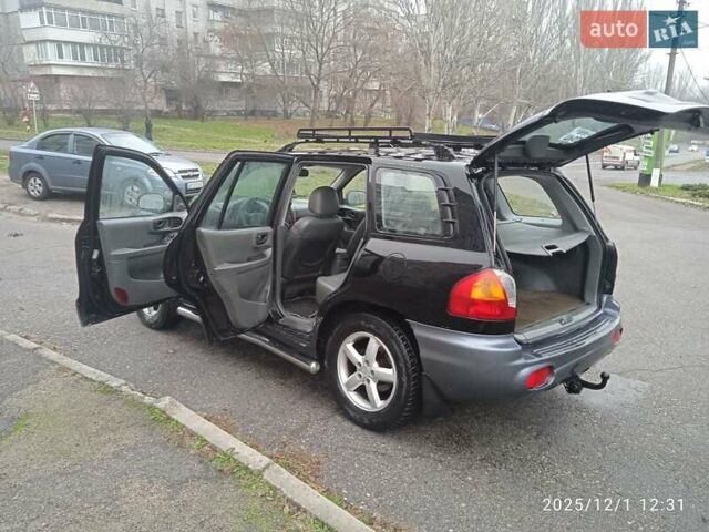 Черный Хендай Санта Фе, объемом двигателя 1.99 л и пробегом 359 тыс. км за 4500 $, фото 8 на Automoto.ua