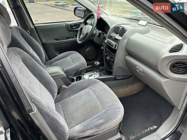 Черный Хендай Санта Фе, объемом двигателя 2 л и пробегом 260 тыс. км за 5000 $, фото 1 на Automoto.ua