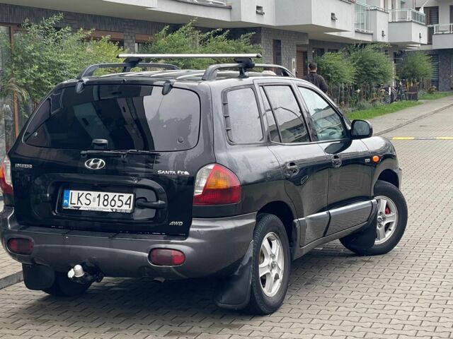 Черный Хендай Санта Фе, объемом двигателя 2 л и пробегом 300 тыс. км за 2925 $, фото 5 на Automoto.ua