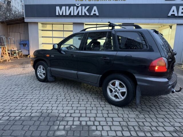 Черный Хендай Санта Фе, объемом двигателя 2 л и пробегом 340 тыс. км за 3500 $, фото 1 на Automoto.ua