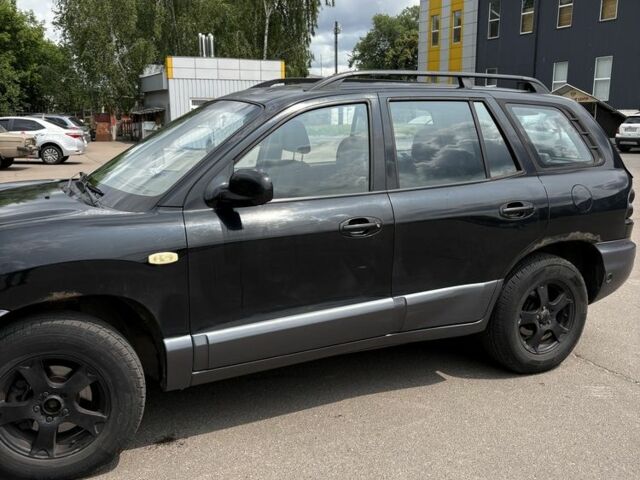 Черный Хендай Санта Фе, объемом двигателя 2.7 л и пробегом 300 тыс. км за 2300 $, фото 1 на Automoto.ua