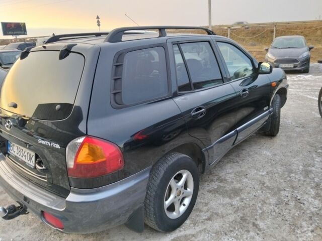 Черный Хендай Санта Фе, объемом двигателя 2.4 л и пробегом 240 тыс. км за 4400 $, фото 8 на Automoto.ua