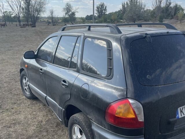 Черный Хендай Санта Фе, объемом двигателя 2.7 л и пробегом 150 тыс. км за 1500 $, фото 1 на Automoto.ua